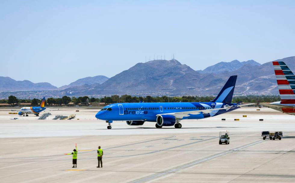 The Breeze Airways inaugural flight arrival taxis to the gate at Harry Reid International Airpo ...