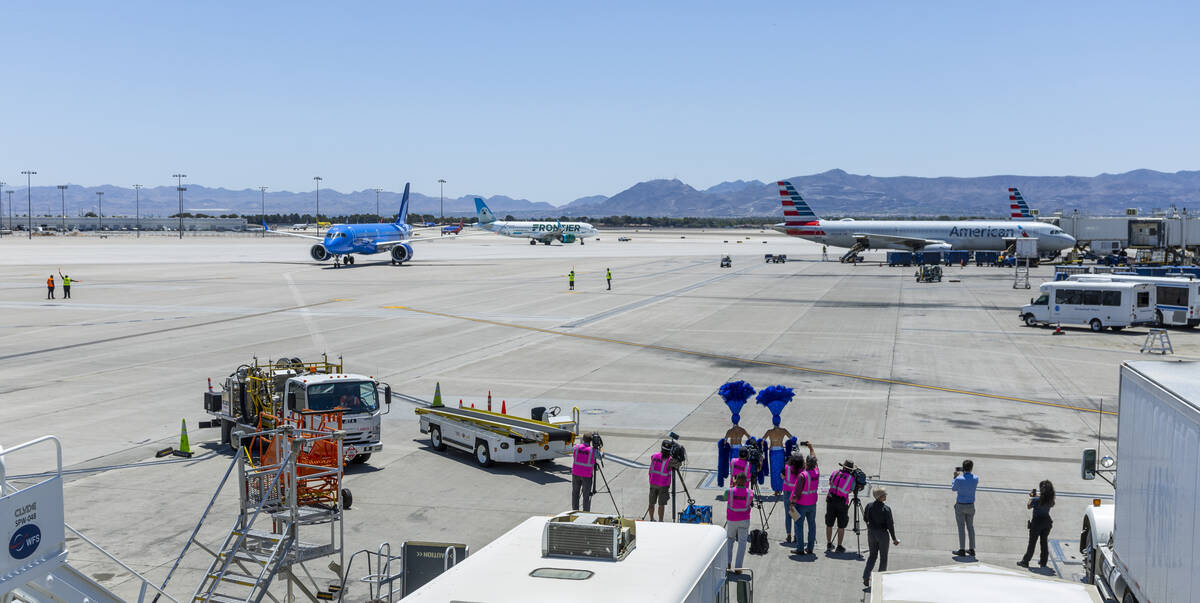 The Breeze Airways inaugural flight arrival taxis to the gate at Harry Reid International Airpo ...