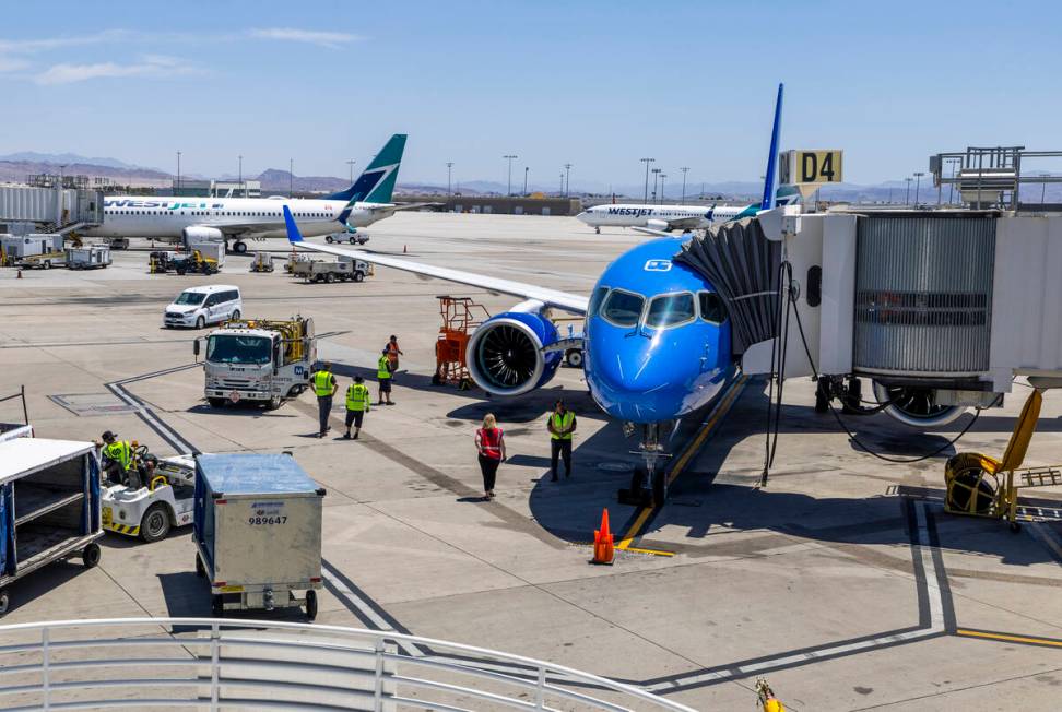 The Breeze Airways inaugural flight arrival deplanes at the gate at Harry Reid International Ai ...