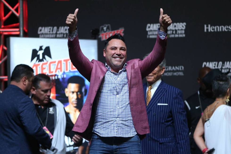 Boxing promoter Oscar De La Hoya reacts to fans during a weigh-in for Saul "Canelo" Alvarez and ...