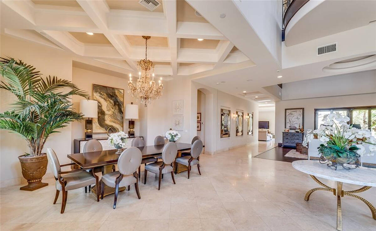 The 6,690-square-foot home has four bedrooms, five baths, an oversized five-car garage, designa ...