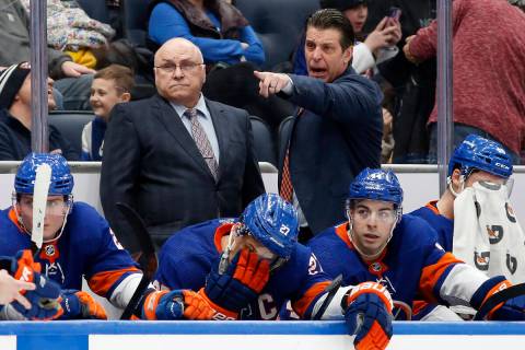 New York Islanders head coach Barry Trotz, left, and assistant coach Lane Lambert stand on the ...