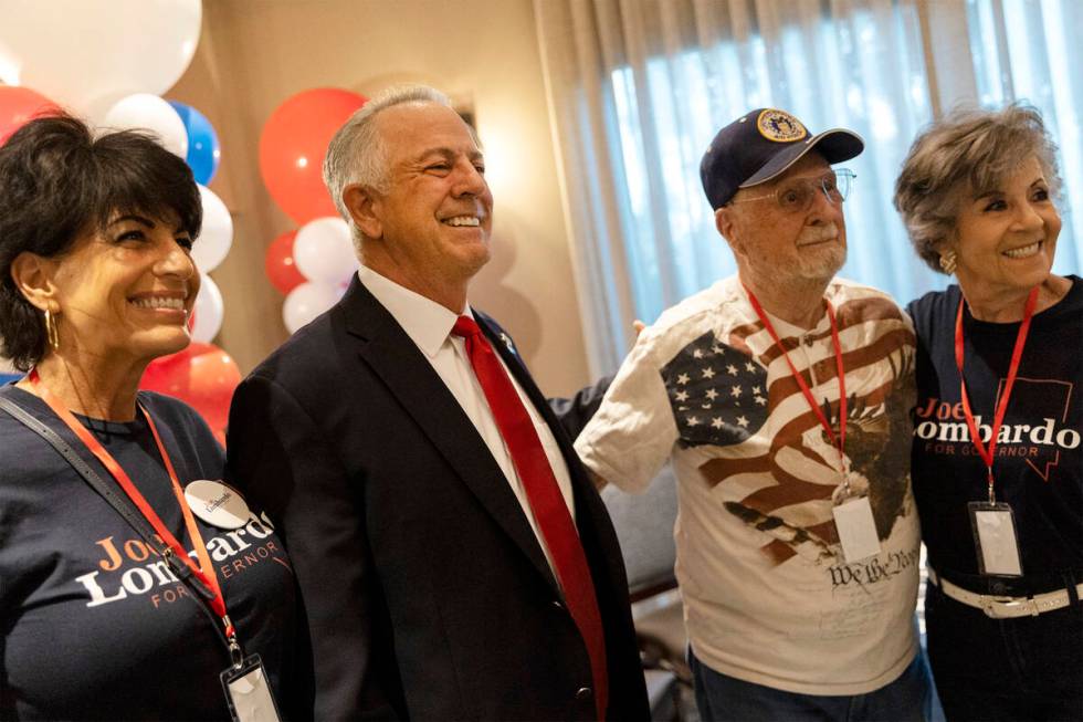 Republican candidate for Nevada governor Joe Lombardo, second from right, poses for photos with ...