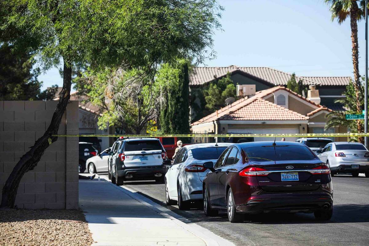Police presence at the scene of a homicide at the 8200 block of Ogee Drive in Las Vegas, Sunday ...