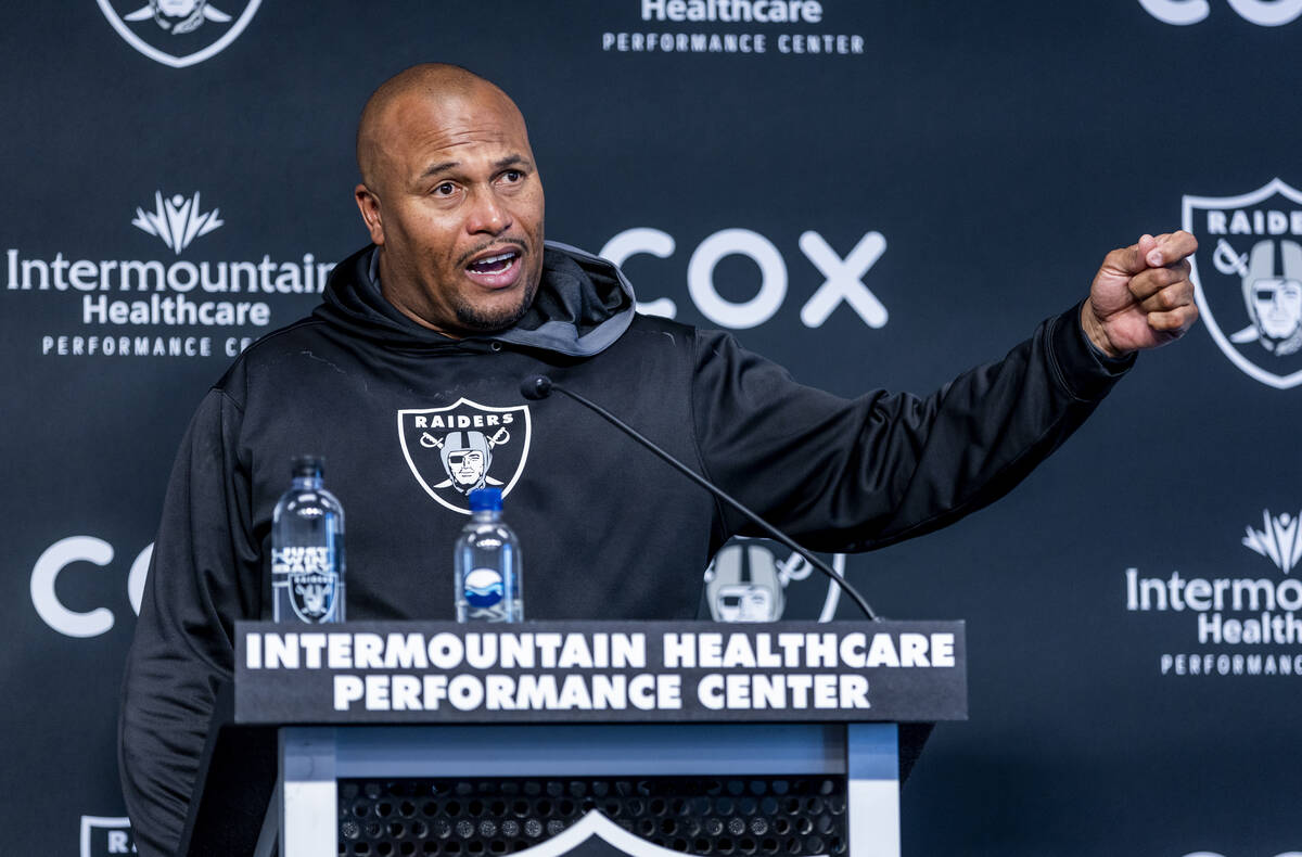 Linebackers coach Antonio Pierce answers a media question during minicamp practice at the Raide ...