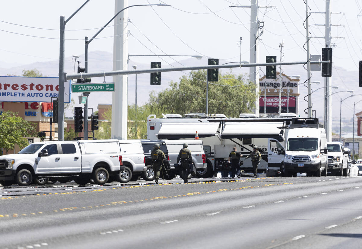 Las Vegas police work a barricade situation on Durango Drive on Monday, June 13, 2022, in Las V ...