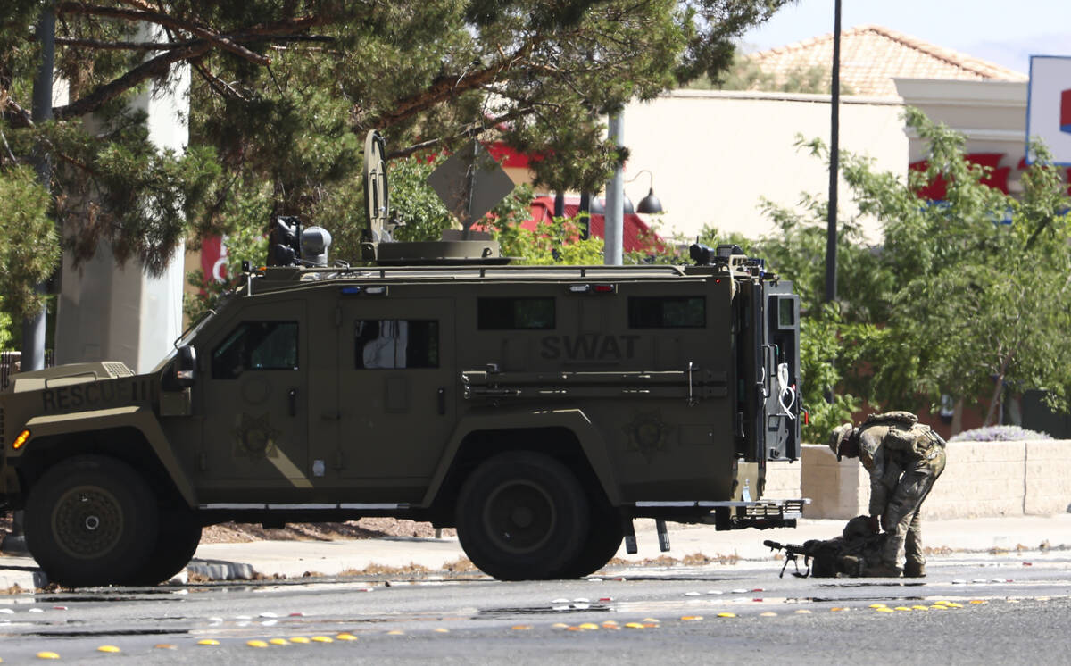 A SWAT vehicle is seen as Las Vegas police work a barricade situation on Durango Drive on Monda ...