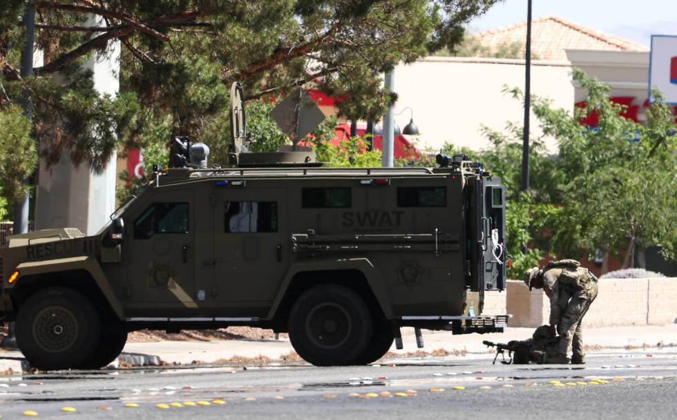 A SWAT vehicle is seen as Las Vegas police work a barricade situation on Durango Drive on Monda ...