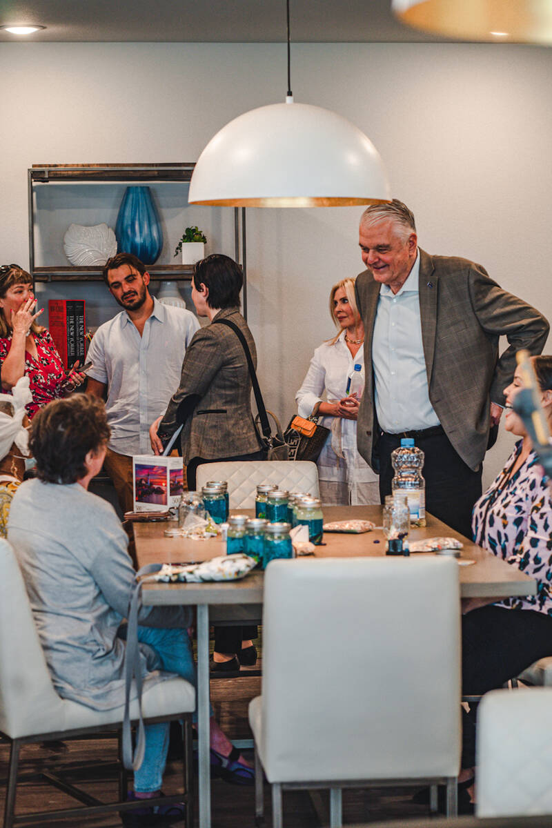 Gov. Steve Sisolak meets with Arioso residents during last week's grand opening event for the n ...