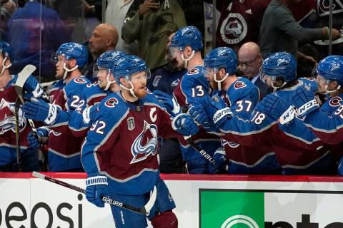 Colorado Avalanche left wing Gabriel Landeskog (92) is congratulated for his goal against the T ...