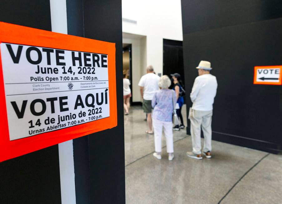 Voters line up to cast their ballots at Sahara West Library on Tuesday, June 14, 2022, in Las V ...