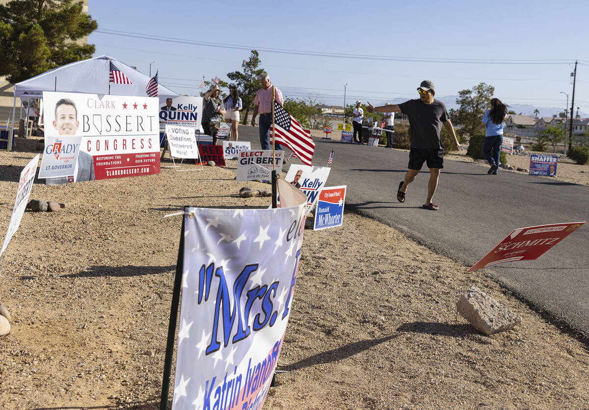 Joel Santiago of Las Vegas leaves a polling station after casting his ballots at Desert Breeze ...