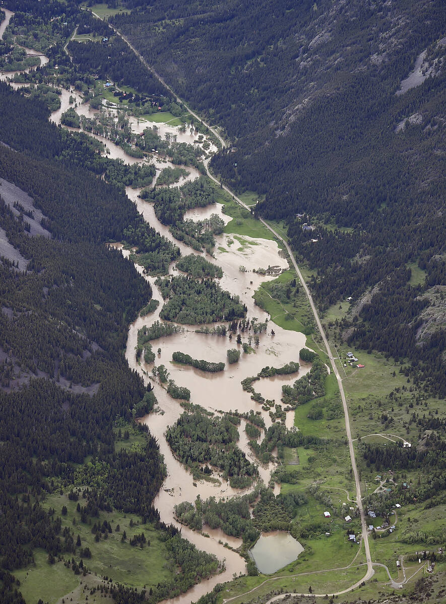 The Boulder River south of Big Timber floods roads and homes on Monday, June 13, 2022, as major ...