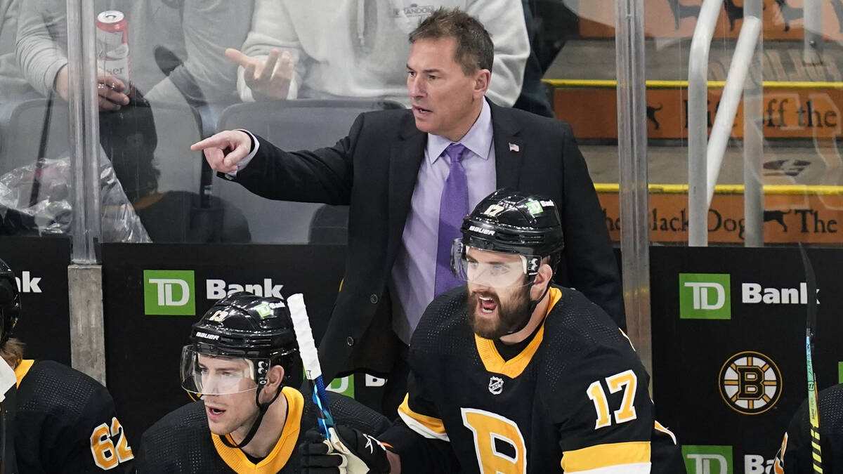 Boston Bruins coach Bruce Cassidy calls to officials during the first period of the team's NHL ...