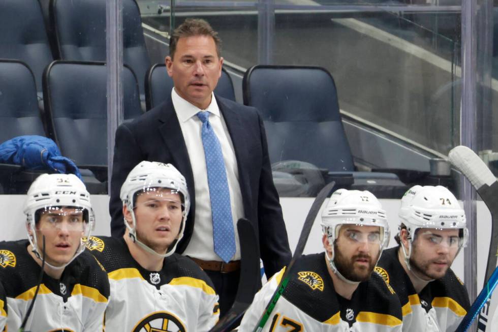 Boston Bruins coach Bruce Cassidy watches during the third period of the team's NHL hockey game ...