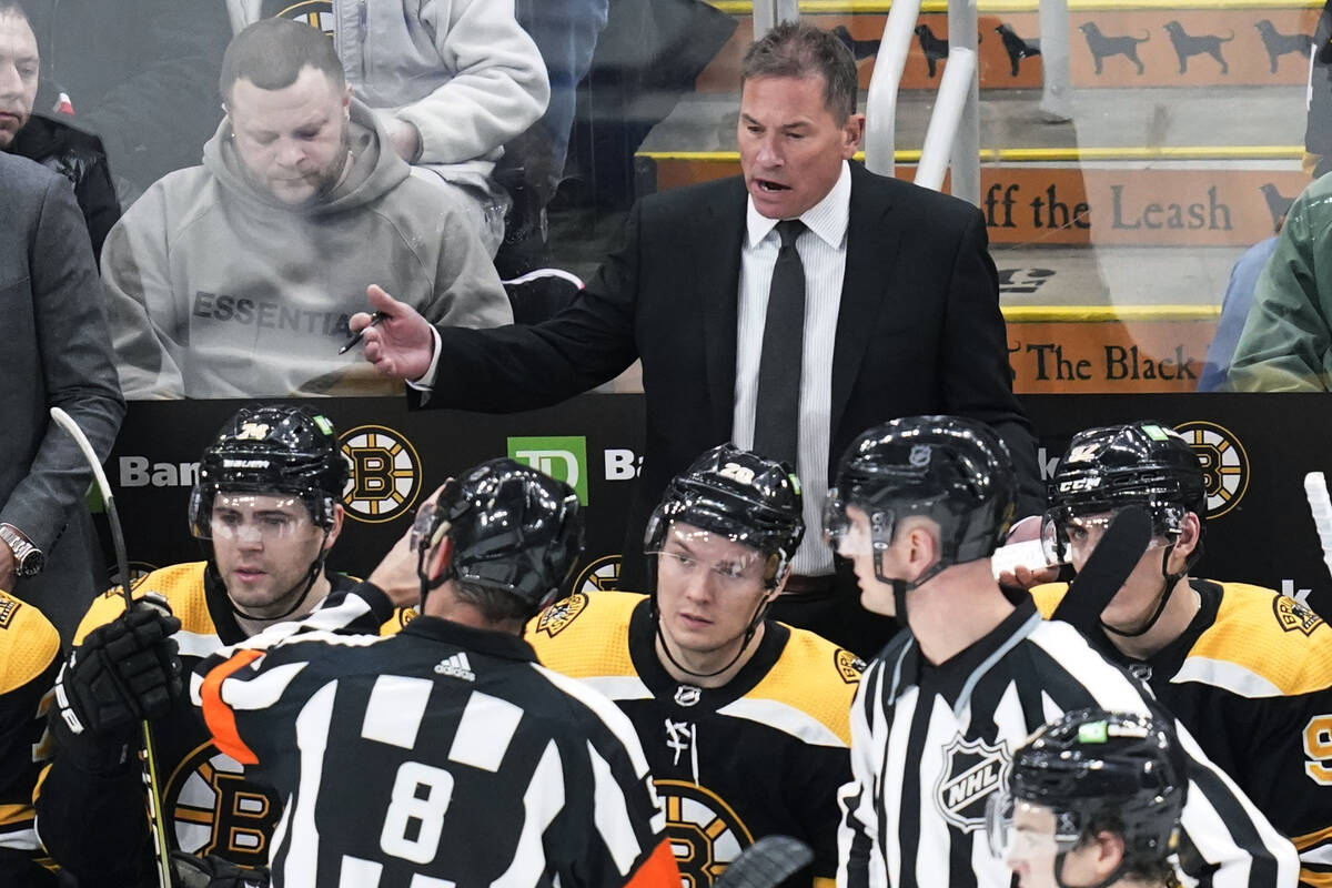Boston Bruins head coach Bruce Cassidy argues with officials during the second period of an NHL ...