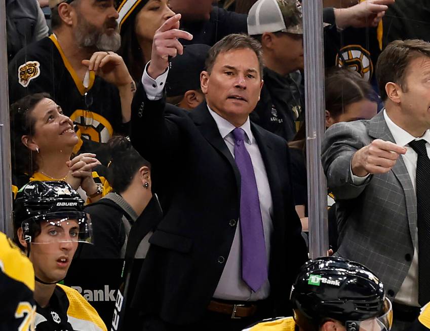 Boston Bruins head coach Bruce Cassidy, center, gestures during the third period of an NHL hock ...
