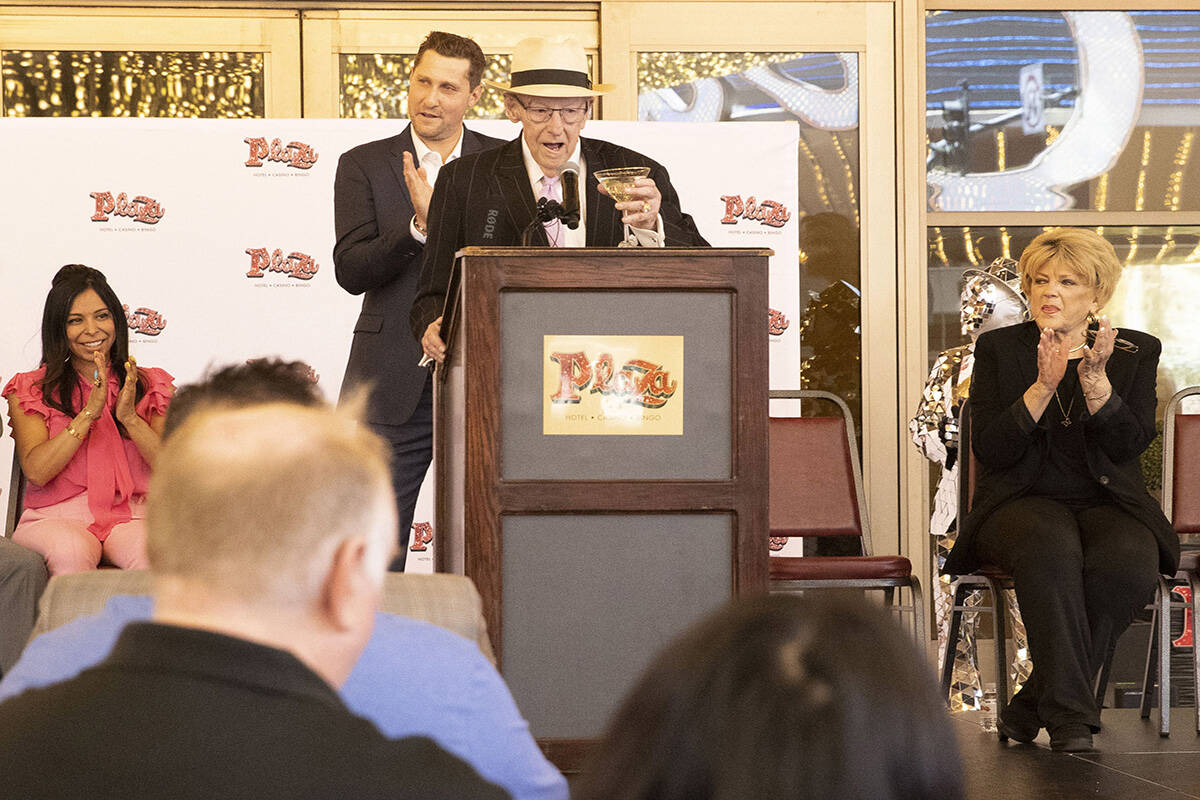 Former Las Vegas mayor Oscar Goodman, center, raises his martini glass for a toast during a new ...