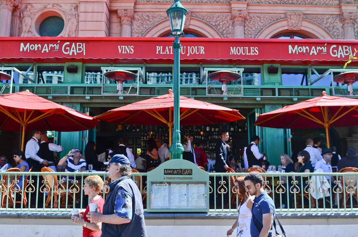 People walk past Mon Ami Gabi outside of Paris Hotel-Casino in Las Vegas Thursday, Sept. 13, 20 ...