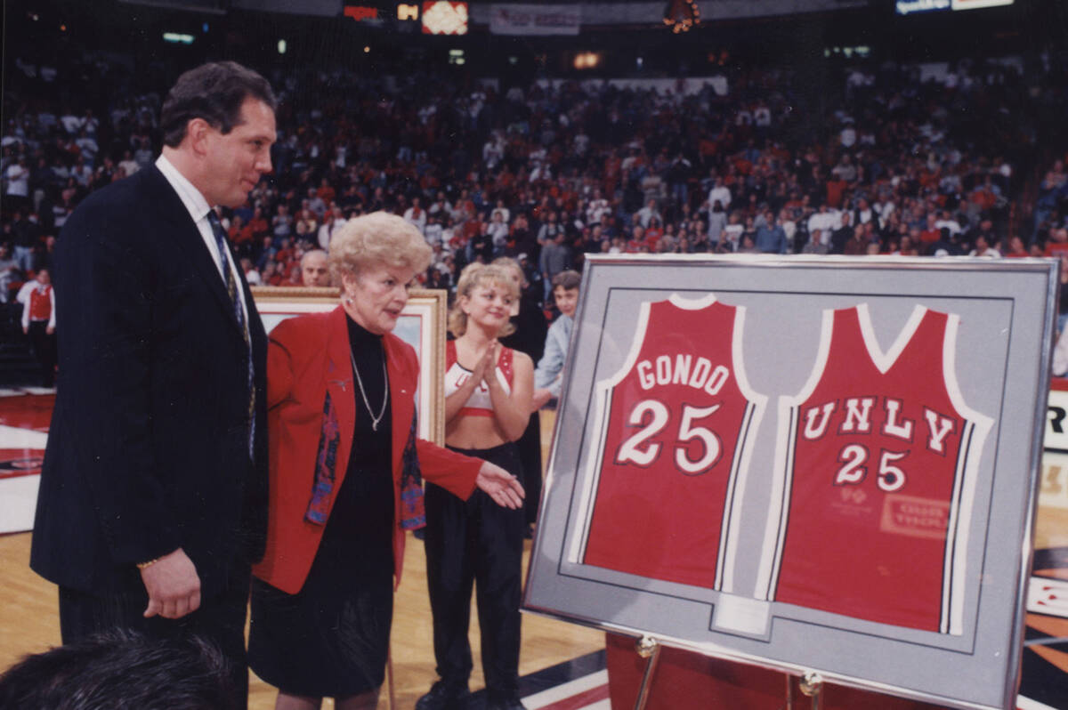 UNLV president Carol Harter presents Glen Gondrezick with his framed jersey during a ceremony r ...