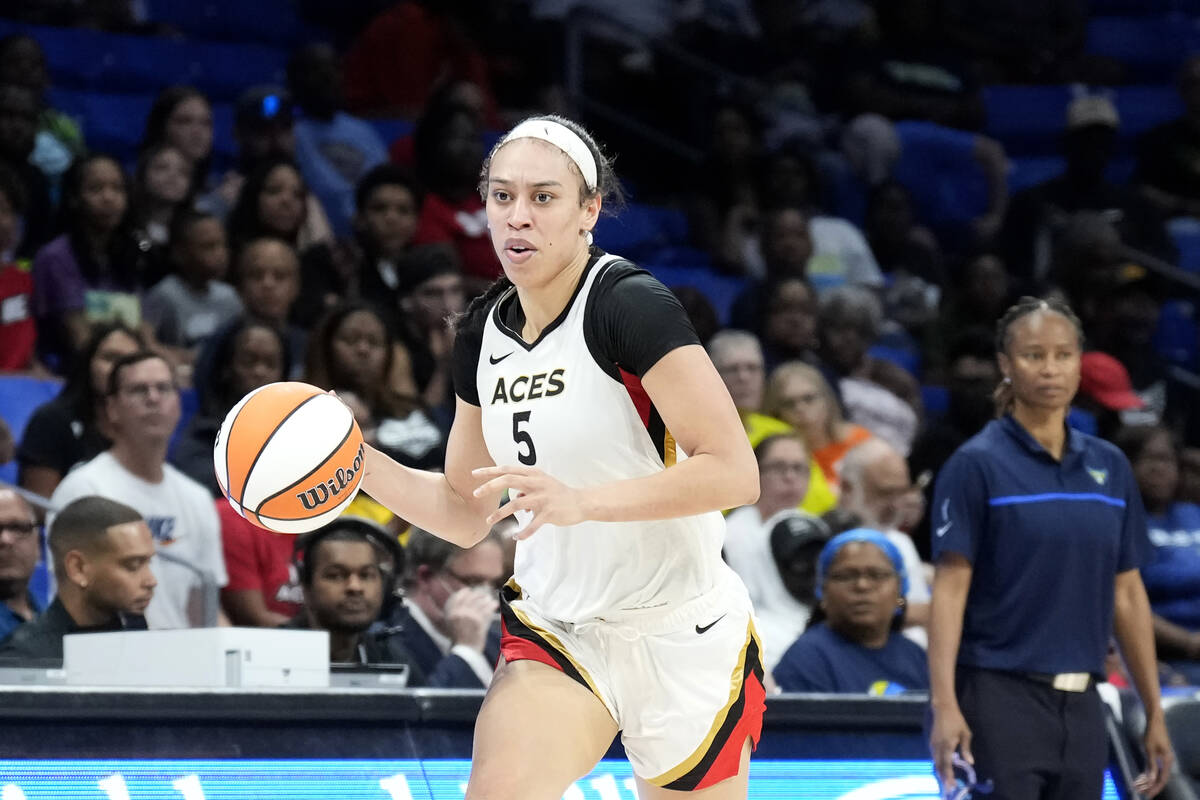 Dearica Hamby #5 of the Las Vegas Aces dribbles the ball during the game against the Dallas Win ...