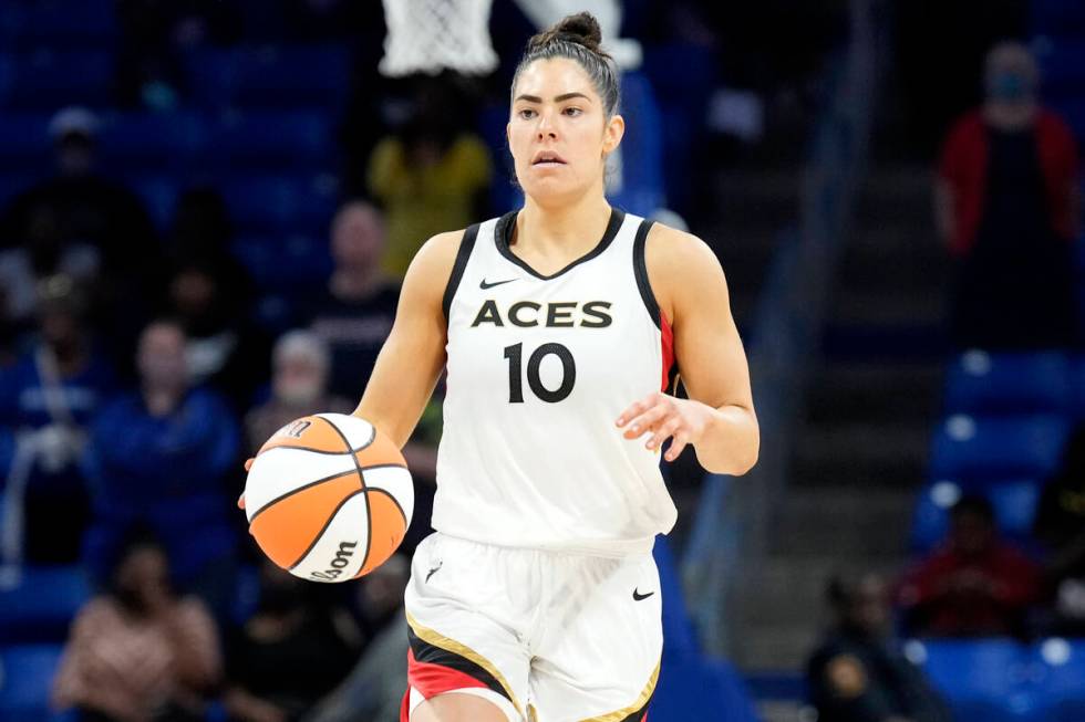 Kelsey Plum #10 of the Las Vegas Aces dribbles the ball during the game against the Dallas Wing ...