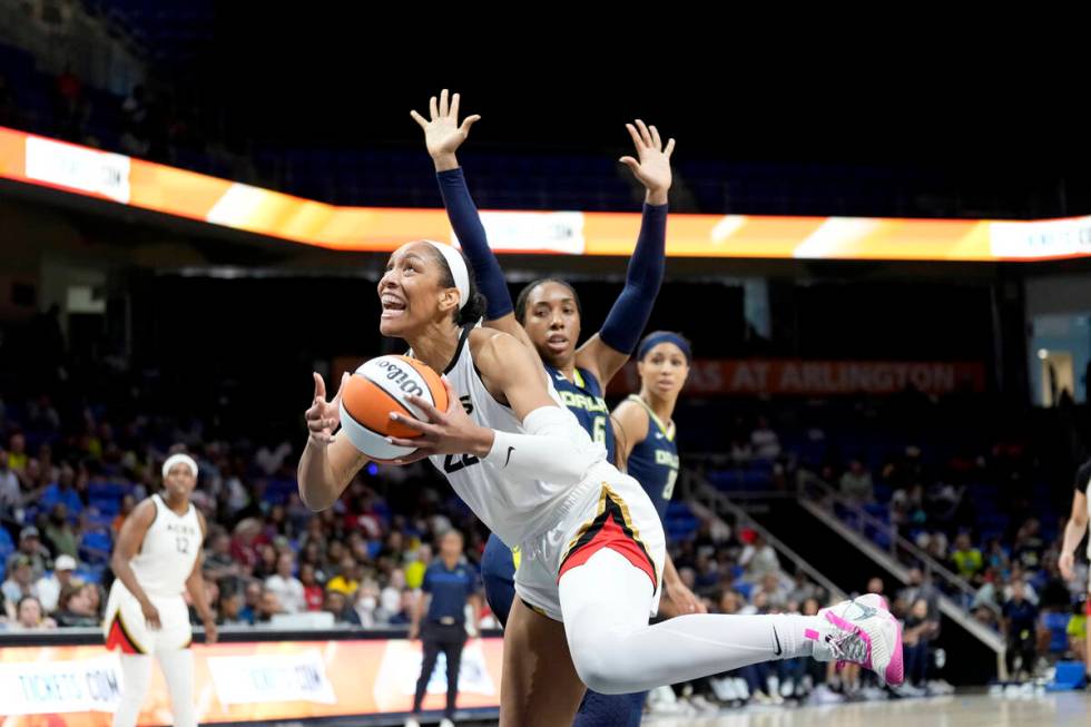 A'ja Wilson #22 of the Las Vegas Aces drives to the basket during the game against the Dallas W ...