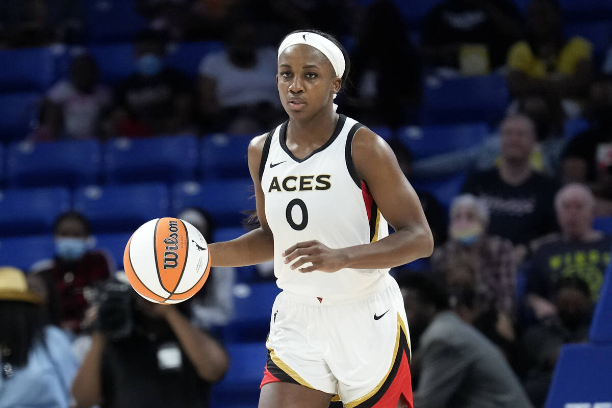 Jackie Young #0 of the Las Vegas Aces dribbles the ball during the game against the Dallas Wing ...