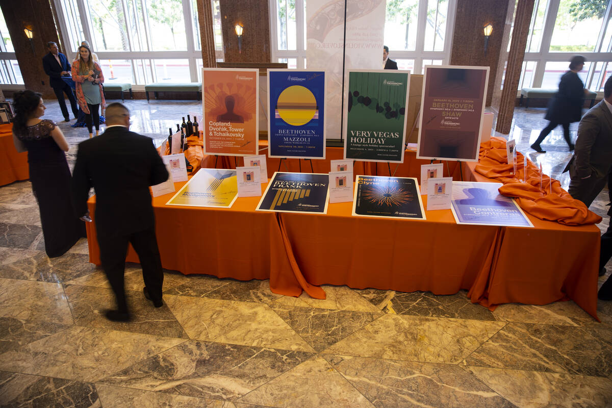 People browse the auction items during the Las Vegas Philharmonic’s fundraising event at ...