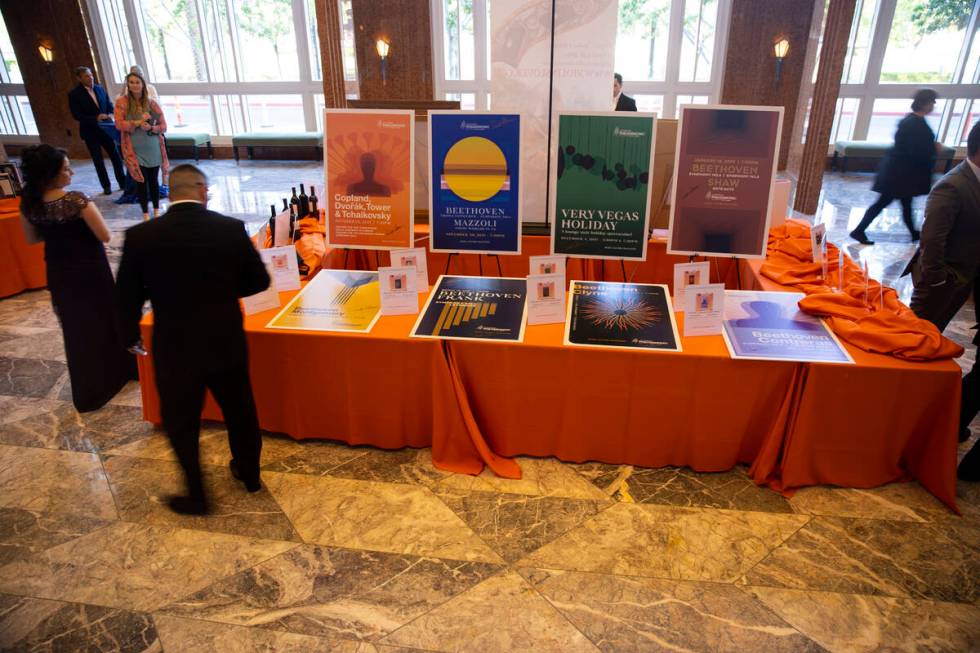 People browse the auction items during the Las Vegas Philharmonic’s fundraising event at ...