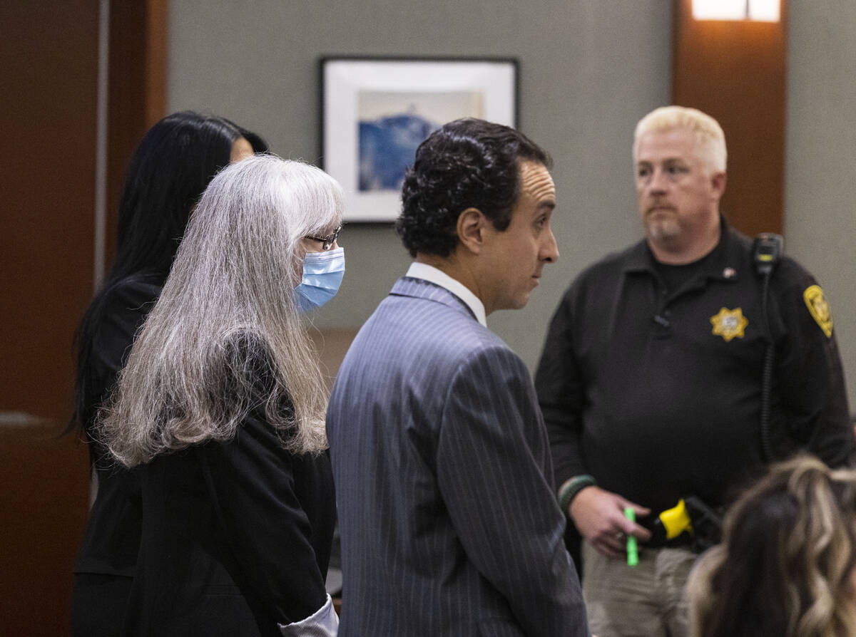 Linda Cooney, center, appears in court with her attorneys Sophie Salcedo, left, and Mike Castil ...