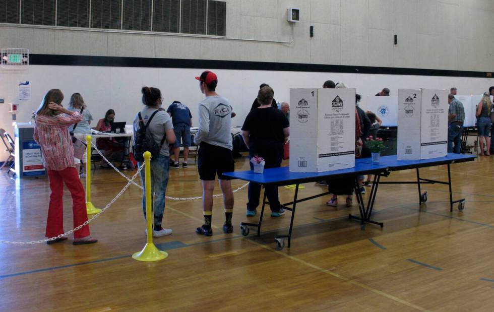 Washoe County voters line up inside a gymnasium at Reed High School in Sparks, Nevada on Tuesda ...