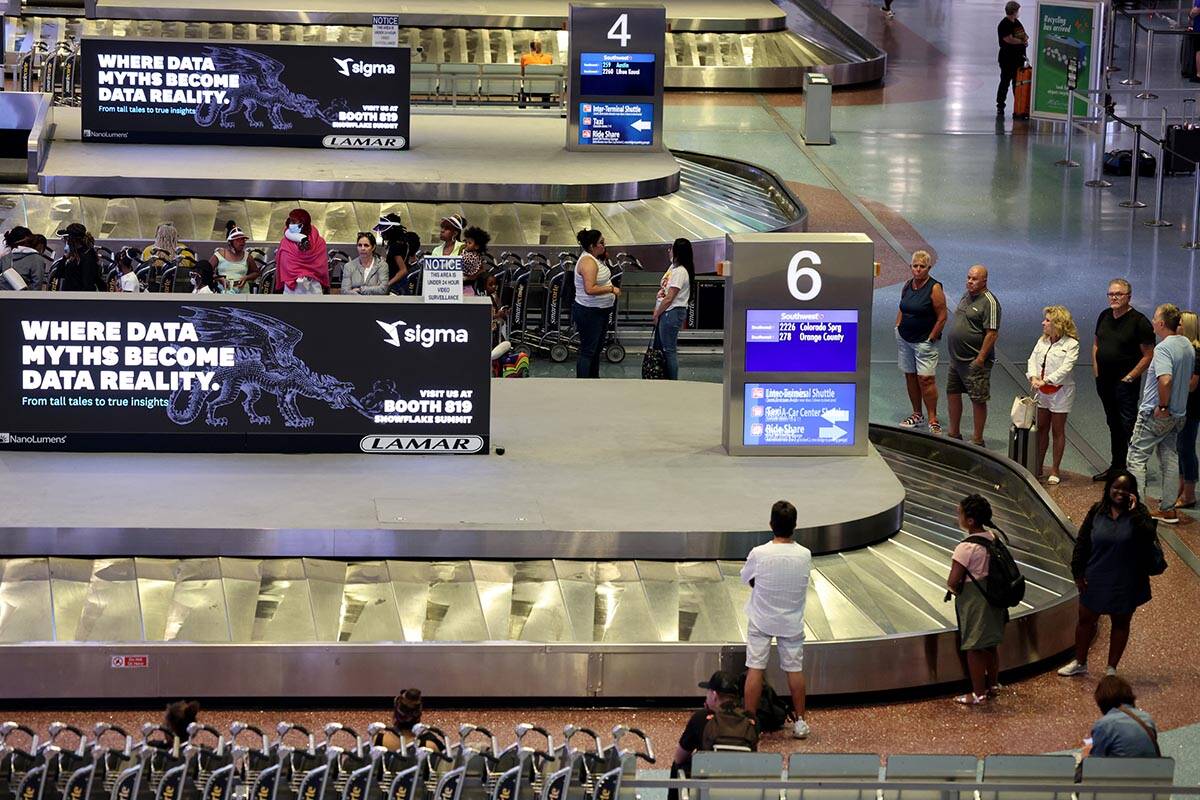Passengers in baggage claim in Terminal 1 at Harry Reid International Airport Wednesday, June 1 ...