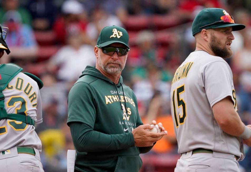 Oakland Athletics manager Mark Kotsay, center, waits at the the mound for a new pitcher during ...