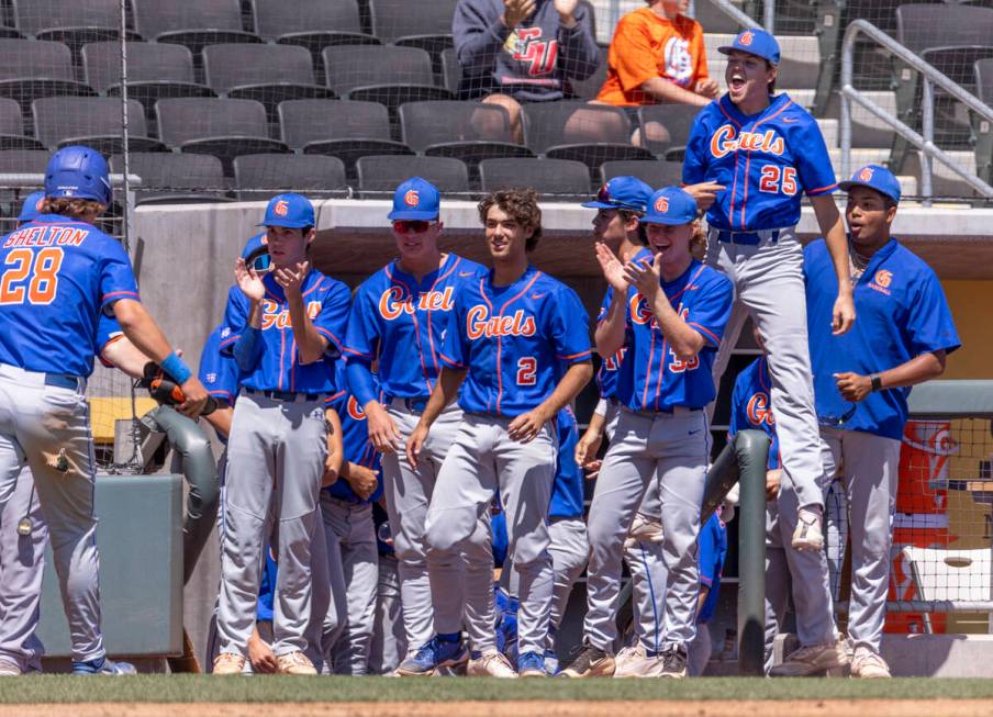 Bishop Gorman players celebrate a score over Basic during their Class 5A state baseball champio ...