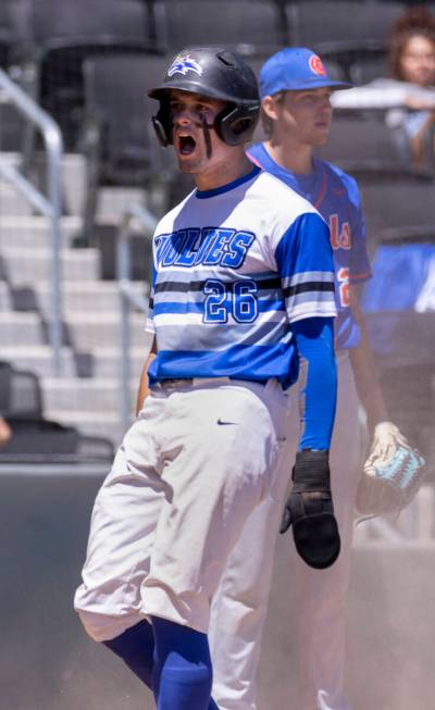 Basic runner Mason Neville (26) celebrates a score past Bishop Gorman during their Class 5A sta ...