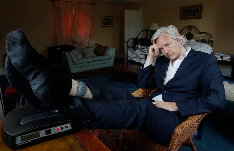 FILE - WikiLeaks founder Julian Assange is seen with his ankle security tag at the house where ...