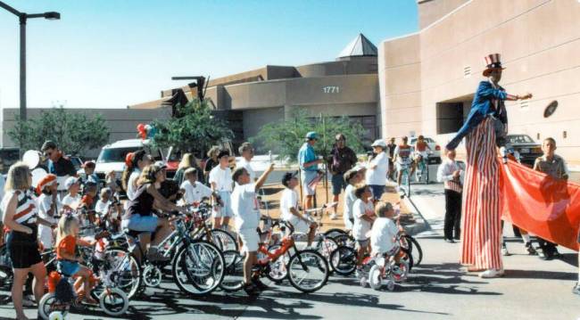 Kids bike in the 1995 Inaugural Patriotic Parade from Summerlin Library to Trails Park. (Courte ...