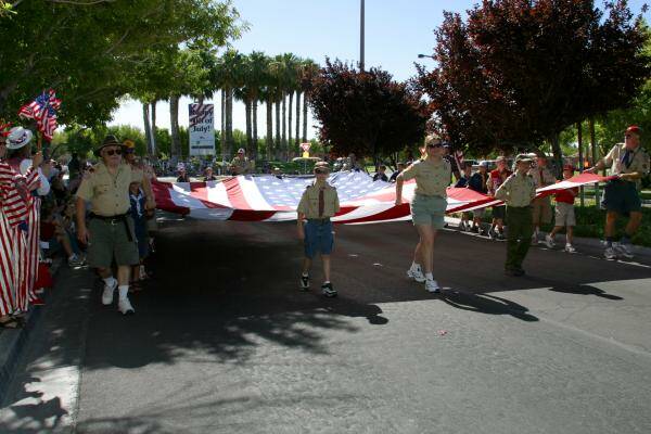 Cub Scout Pack 812 carries the American flag during the 2004 parade. The flag is carried today ...