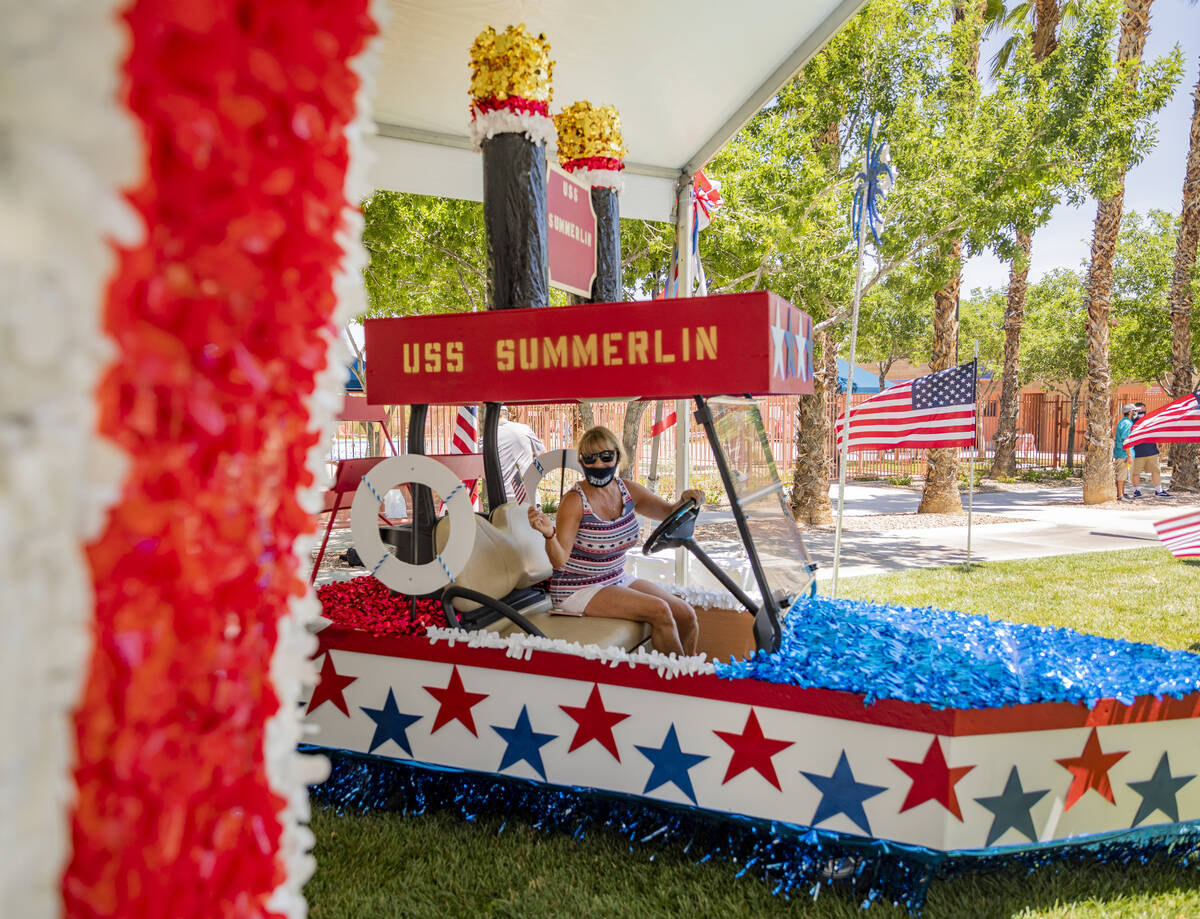 Leslie Stringham of Las Vegas sits in a float taking pictures during a preview of the virtual S ...