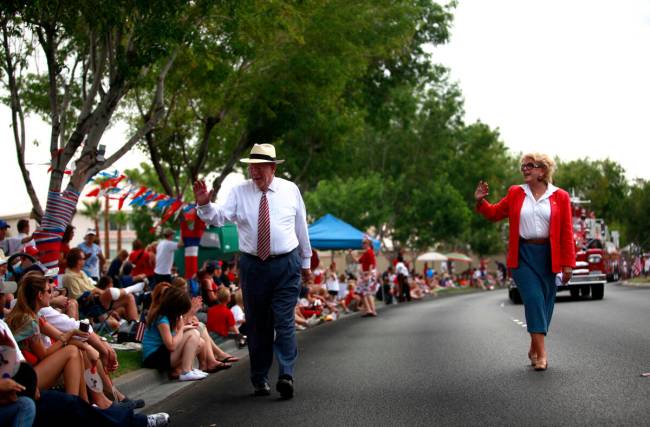 Outgoing Mayor Oscar Goodman walks with his wife, Mayor-elect Carolyn Goodman, as they march in ...