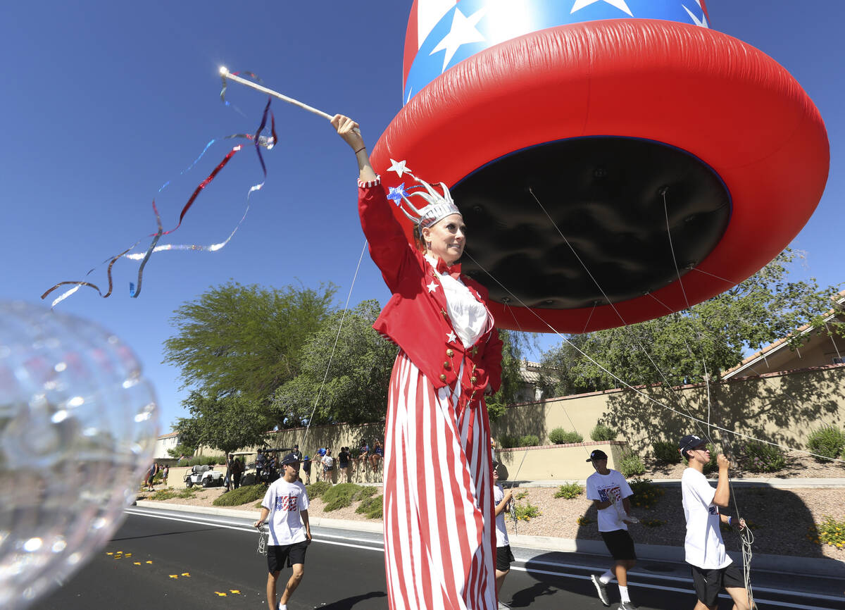 Sara Back waves her baton during the 2019 Summerlin Council Patriotic Parade in Las Vegas. (Mic ...