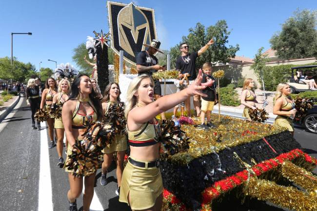 Golden Knights cheerleaders look in shock after seeing a float go up in the air during the 2019 ...