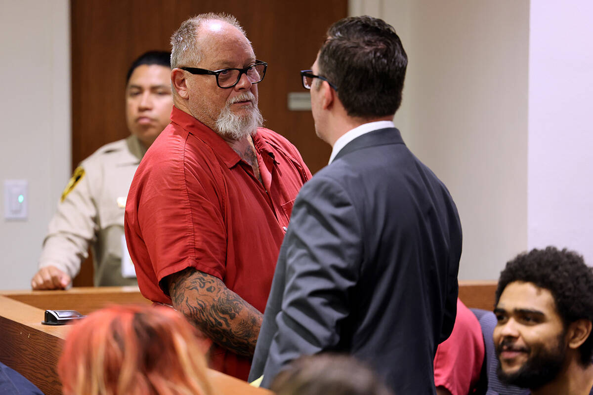 Richard Devries, 66, talks to his attorney Robert DeMarco during his initial court appearance i ...
