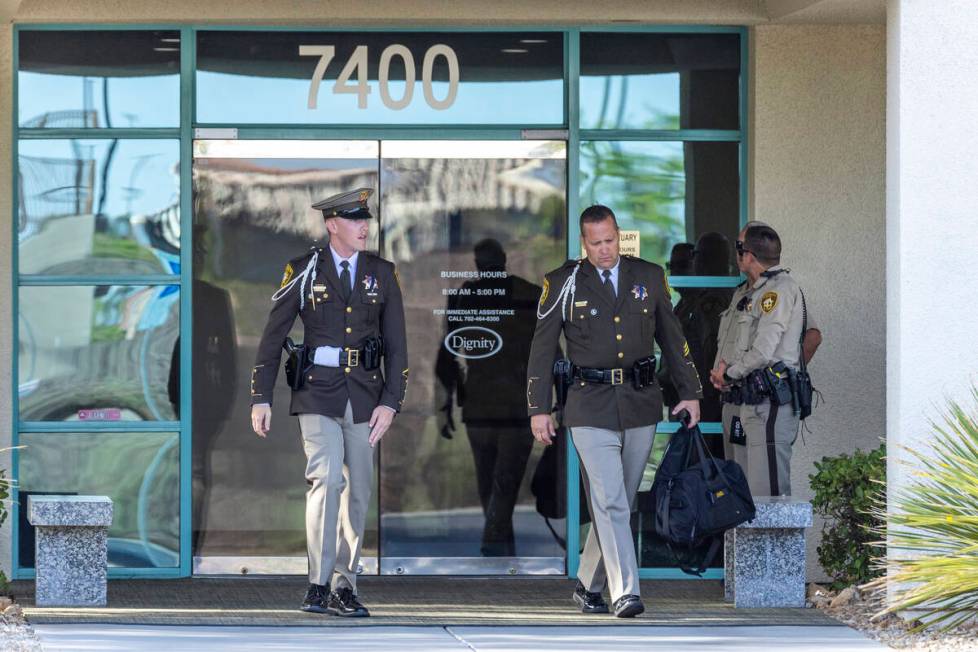 Officers leave a public viewing at Palm Cheyenne Mortuary for Metro Detective Justin Terry, who ...