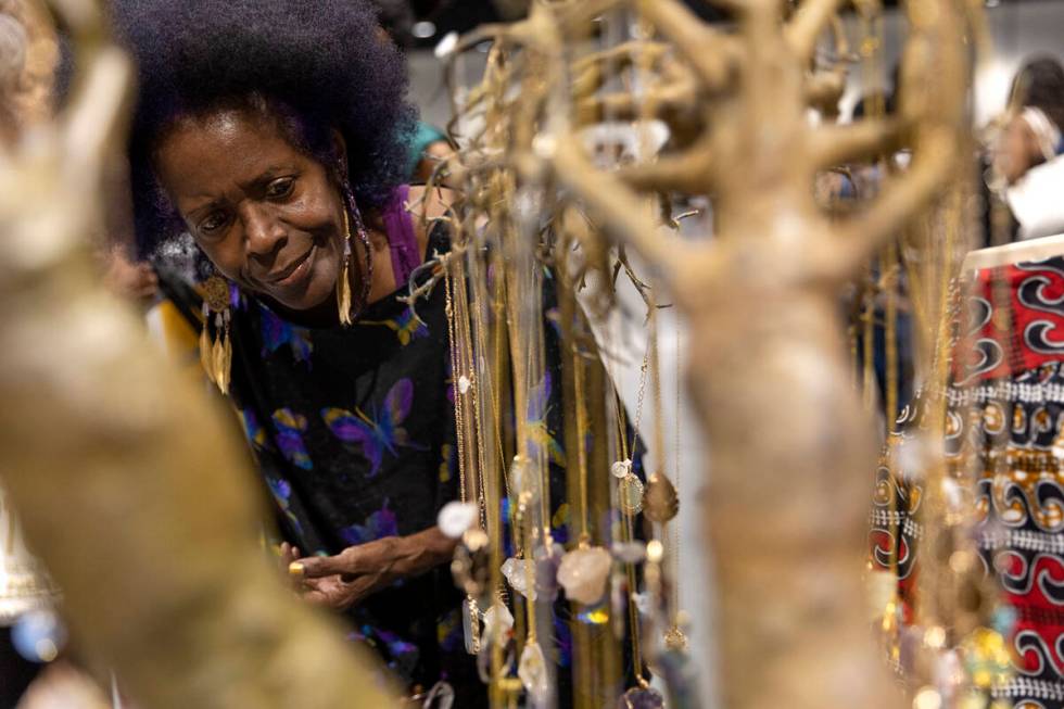 Stephanie DuBois, of Las Vegas, shops for jewelry during a Juneteenth expo at World Market Cent ...