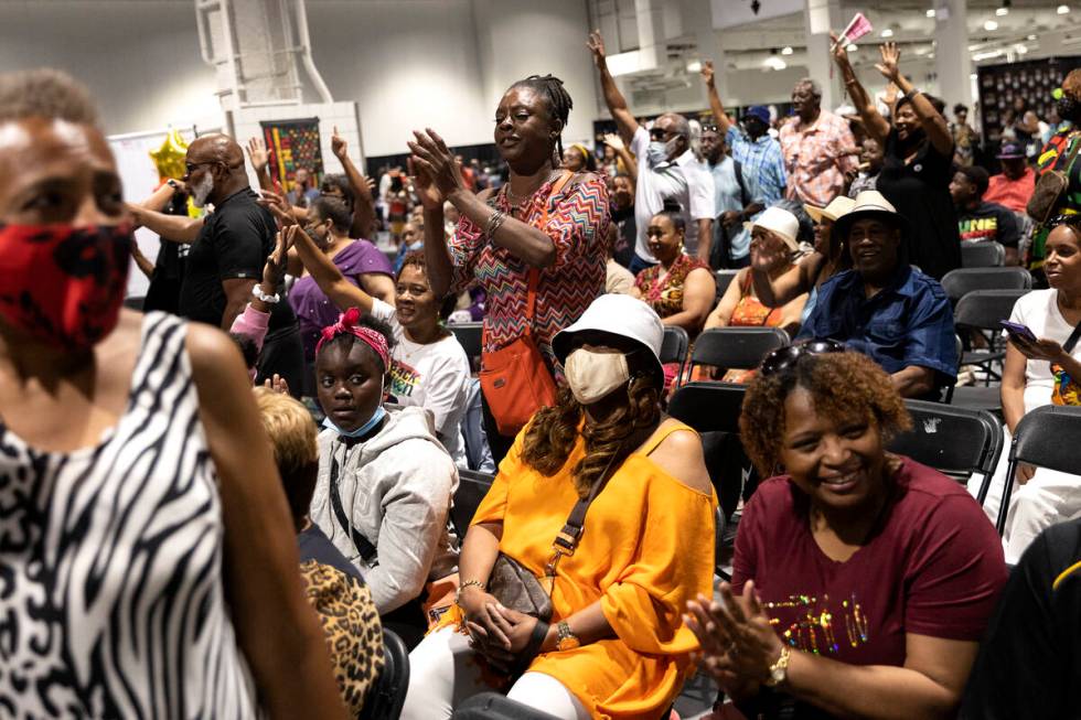 The crowd claps for performers during a Juneteenth expo at World Market Center on Saturday, Jun ...