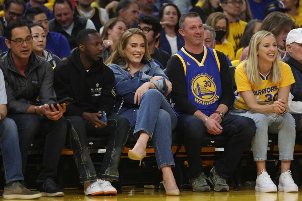 Adele, center, watches during Game 2 of the NBA basketball playoffs Western Conference finals b ...