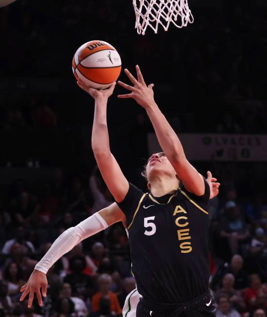 Las Vegas Aces forward Dearica Hamby (5) lays up the ball against the Minnesota Lynx during the ...
