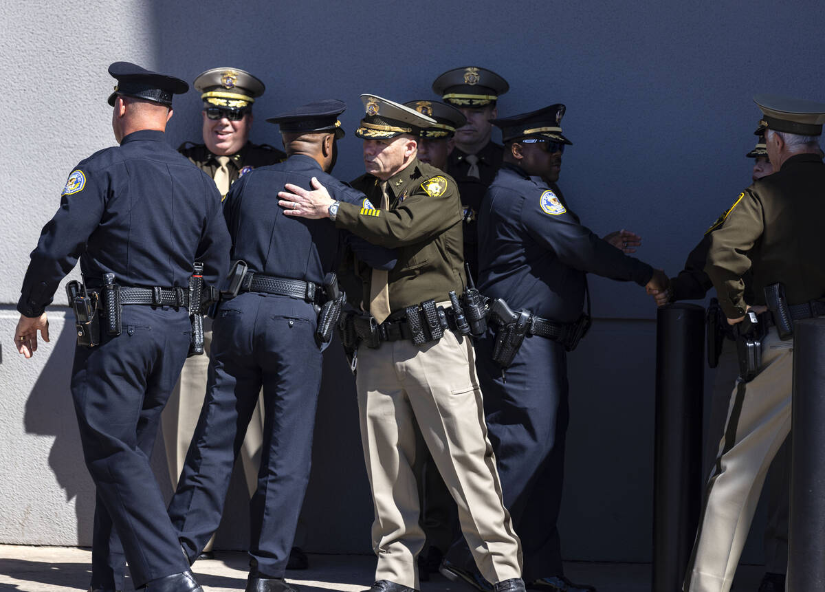 Police officers gather outside Central Christian Church during the funeral for Las Vegas police ...